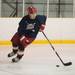 Lincoln Park police officer Sean Nicklas skates the puck down the ice during the Washtenaw County police and firefighter's Guns-n-Hoses charity hockey game, Sunday, Jan. 13.
Courtney Sacco I AnnArbor.com 